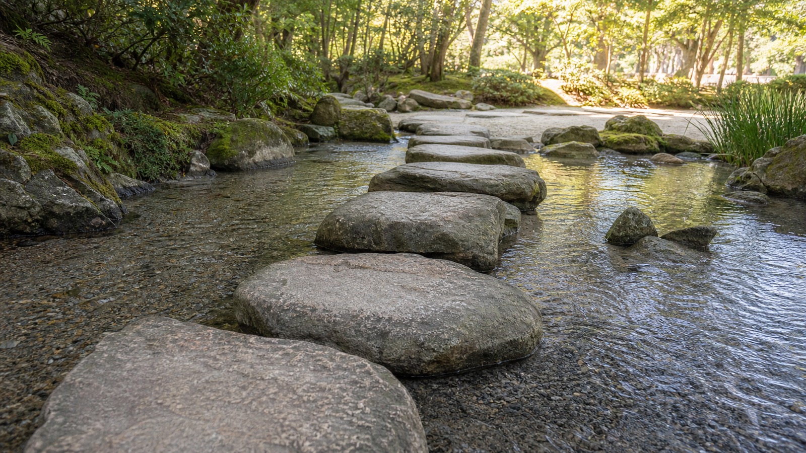 Stable stepping stones crossing a shallow clear stream toward a sunlit garden path